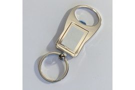 Porte-clé décapsuleur en métal argenté ovale 3,5 x 9,5 cm (vendu à l'unité)